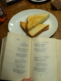 Reading Robert Burns poetry while eating a toastie.